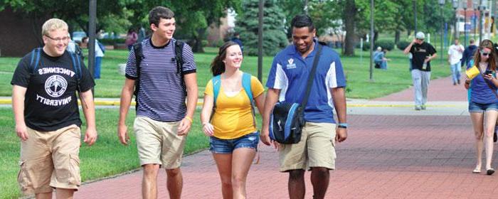 students walking down sidewalk